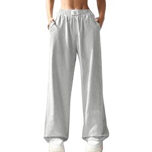 New!  Grey and white stripped pajama pants with pockets.  Size medium